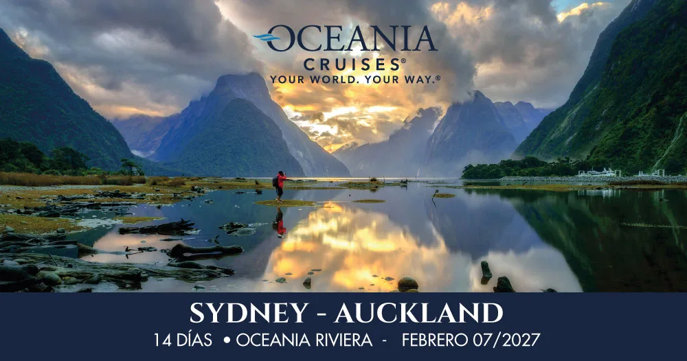 Paisaje montañoso de Nueva Zelanda con fiordos y aguas tranquilas, representando un crucero de 14 días del Oceania Riviera desde Sídney hasta Auckland en febrero de 2027.