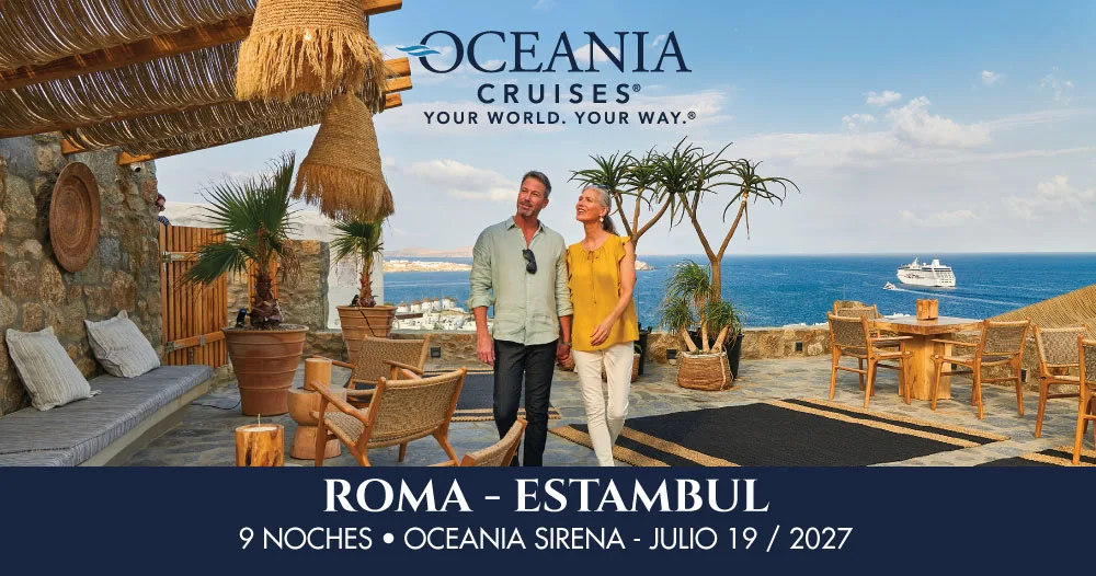 Pareja disfrutando de una terraza con vista al mar Mediterráneo y un crucero al fondo, en la promoción del Oceania Sirena de Roma a Estambul, julio de 2027.
